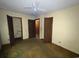 Bedroom with open closet and attached bathroom at 41 Harmon St., Hemingway, SC 29554