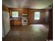 Empty Kitchen featuring wood cabinets, older appliances and laminate flooring at 41 Harmon St., Hemingway, SC 29554