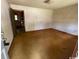 Empty Living room space with old carpet and entrance to kitchen at 41 Harmon St., Hemingway, SC 29554