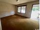 Empty Living room area featuring a view of the windows and exterior door at 41 Harmon St., Hemingway, SC 29554