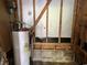 Water heater surrounded by exposed studs and beams at 41 Harmon St., Hemingway, SC 29554