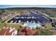 Aerial view showcasing the marina with boat docks and a community pool surrounded by residences at 4396 Baldwin Ave. # 1, Little River, SC 29566
