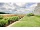 Beautiful lawn and landscape leading down to the waterfront, close to the home's back porch at 4396 Baldwin Ave. # 1, Little River, SC 29566
