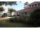 Charming clubhouse exterior with manicured landscaping and American flag waving at 4396 Baldwin Ave. # 1, Little River, SC 29566