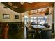 Cozy common area with tables, chairs, and views of the river and marina from the clubhouse at 4396 Baldwin Ave. # 1, Little River, SC 29566
