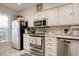 Bright kitchen featuring stainless appliances, ample storage, and neutral countertops; ideal for cooking and entertaining at 4396 Baldwin Ave. # 1, Little River, SC 29566