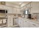 Well-maintained kitchen with stainless steel appliances, sleek white cabinets, and attractive marble backsplash at 4396 Baldwin Ave. # 1, Little River, SC 29566