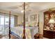 Comfortable bedroom featuring a four-poster bed, and access to the enclosed porch at 4396 Baldwin Ave. # 1, Little River, SC 29566
