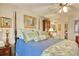 Comfortable bedroom featuring a four-poster bed, green accents, and an antique writing desk at 4396 Baldwin Ave. # 1, Little River, SC 29566