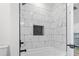 Contemporary bathroom showcases a luxurious walk-in shower with elegant tile and black hardware at 4617 Hedrick St., North Myrtle Beach, SC 29582