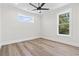 Bright, airy bedroom with luxury vinyl flooring and large windows with beautiful outdoor views at 4617 Hedrick St., North Myrtle Beach, SC 29582