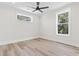 Bright bedroom with two large windows providing ample natural light and wood flooring at 4617 Hedrick St., North Myrtle Beach, SC 29582