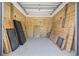 Spacious garage with wood-paneled walls, offering ample storage and potential workshop space at 4617 Hedrick St., North Myrtle Beach, SC 29582