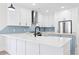 Gorgeous kitchen with white quartz countertops, stainless appliances and an island with butcher block at 4617 Hedrick St., North Myrtle Beach, SC 29582