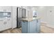 Updated kitchen featuring a butcher block island, stainless steel appliances, and ample cabinet space at 4617 Hedrick St., North Myrtle Beach, SC 29582