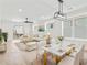 Bright, open-concept living and dining area featuring modern furnishings and lots of natural light at 4617 Hedrick St., North Myrtle Beach, SC 29582