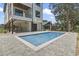 Inviting backyard featuring a pristine pool with paved patio and a modern home exterior at 4617 Hedrick St., North Myrtle Beach, SC 29582