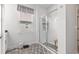 Bright bathroom featuring a glass shower enclosure with a bench, vanity, and window with blinds at 462 Pacific Commons Dr., Surfside Beach, SC 29575