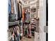 Walk-in closet features built-in shelving with ample space for hanging and storing clothing at 462 Pacific Commons Dr., Surfside Beach, SC 29575