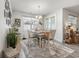 Bright dining room features counter height dining table, pendant lighting and a decorative rug on top of vinyl plank floors at 462 Pacific Commons Dr., Surfside Beach, SC 29575