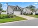 View of a well-maintained single-Gathering home with a two-car garage and a landscaped front yard at 462 Pacific Commons Dr., Surfside Beach, SC 29575