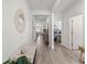Inviting entryway with hardwood floors, neutral walls, and view into the main bedroom at 462 Pacific Commons Dr., Surfside Beach, SC 29575