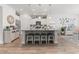 Bright kitchen with white cabinets, granite countertops, a large island, and stainless steel appliances at 462 Pacific Commons Dr., Surfside Beach, SC 29575