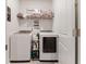Well-organized laundry room featuring a newer washer and dryer, with shelving for supplies at 462 Pacific Commons Dr., Surfside Beach, SC 29575
