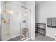 Tiled walk-in shower featuring built-in shelving, a bench, and gray toned accents at 462 Pacific Commons Dr., Surfside Beach, SC 29575