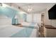 Bright bedroom featuring two beds, ensuite closets, and a TV at 4800 S Ocean Blvd. # 1221, North Myrtle Beach, SC 29582