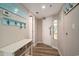 Hallway with coat racks, cute decor, and stained glass door at 4800 S Ocean Blvd. # 1221, North Myrtle Beach, SC 29582