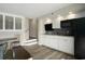 Open floor plan with kitchen, cabinets, and access to stairs to upper level at 4800 S Ocean Blvd. # 1221, North Myrtle Beach, SC 29582