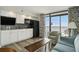 Open floor plan with kitchen, cabinets, and access to balcony with ocean views at 4800 S Ocean Blvd. # 1221, North Myrtle Beach, SC 29582