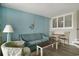 Living room with sofa, chairs, table, and mermaid decor at 4800 S Ocean Blvd. # 1221, North Myrtle Beach, SC 29582