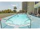 Inviting outdoor pool area with lounge chairs, perfect for relaxation and enjoying the sunshine at 4800 S Ocean Blvd. # 1221, North Myrtle Beach, SC 29582
