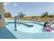 Gathering-friendly splash pool with shallow water and playful water features for safe entertainment at 4800 S Ocean Blvd. # 1221, North Myrtle Beach, SC 29582