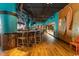 Lively restaurant bar area with a full bar, surfboards and seating at 4800 S Ocean Blvd. # 1221, North Myrtle Beach, SC 29582