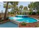 Inviting water feature with dolphin accents and tropical landscaping provides a relaxing outdoor amenity at 4800 S Ocean Blvd. # 1221, North Myrtle Beach, SC 29582