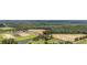 Aerial view of a charming home nestled among trees and farmland, promising a peaceful rural lifestyle at 4860 Highway 378, Conway, SC 29527