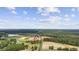 A beautiful aerial view of a property surrounded by nature and farmland, offering a serene and private setting at 4860 Highway 378, Conway, SC 29527