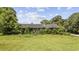 A charming home with a classic design surrounded by mature trees, creating a serene and private atmosphere at 4860 Highway 378, Conway, SC 29527