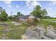 A single-story brick home with an overgrown yard and dilapidated surroundings at 4860 Highway 378, Conway, SC 29527
