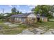 Ranch-style brick home with overgrown landscaping and neglected surroundings at 4860 Highway 378, Conway, SC 29527
