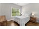 Cozy bedroom with a queen bed, two nightstands, and wood-look floors at 5115 Huston Rd., Conway, SC 29526