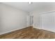 Bedroom featuring wood-look floors, neutral-painted walls, and a closet for storage at 5115 Huston Rd., Conway, SC 29526