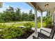 Inviting front porch with rocking chairs, landscaping and view of the street at 5115 Huston Rd., Conway, SC 29526