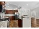 Well-lit kitchen boasting stainless steel appliances, granite countertops, breakfast bar, and hardwood floors at 5115 Huston Rd., Conway, SC 29526
