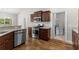 Stylish kitchen featuring stainless steel appliances, hardwood floors, granite countertops, and ample storage at 5115 Huston Rd., Conway, SC 29526