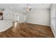 Spacious living room with hardwood floors, neutral walls, fan, and vaulted ceilings create an open and airy ambiance at 5115 Huston Rd., Conway, SC 29526