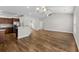 Spacious living room featuring beautiful wood floors, neutral walls, and arched entryways at 5115 Huston Rd., Conway, SC 29526